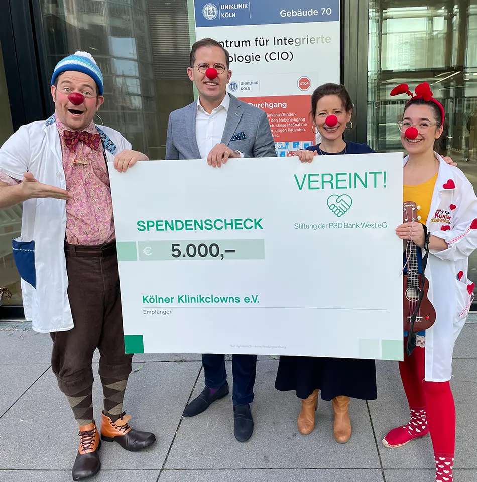 Spendenscheck für Kölner Klinikclowns e.V. - PSD Bank West eG